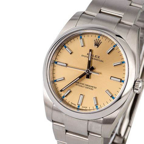 Rolex Oyster Perpetual 114200 Champagne Dial 